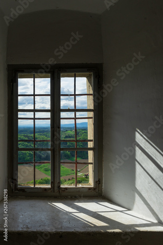 The landscape shines through the old castle s windows