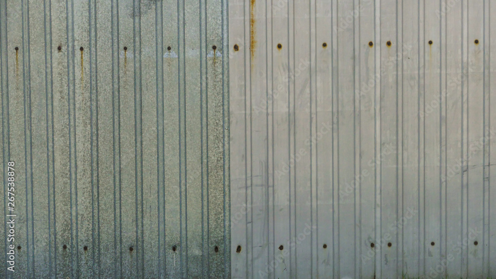 Background image metal fence with rust and dents Background image metal fence with rust and dents