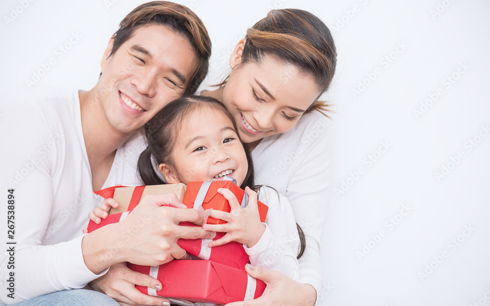 Mother's Day gift. Happy asian girl greeting young surprised mom, giving  her handmade card and wrapped gift box Stock Photo - Alamy