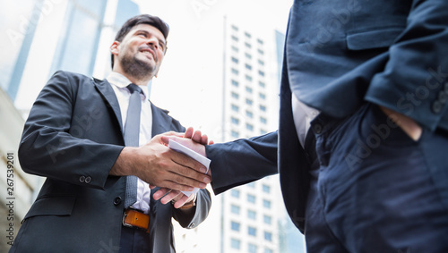 Billede på lærred Portrait of two business man giving bribe money in white envelope corruption scam