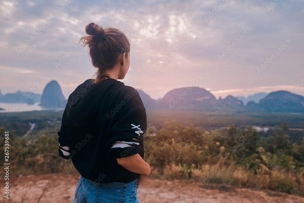 Rear view of a young woman enjoying the awesome view of Ao Phang Nga National Park