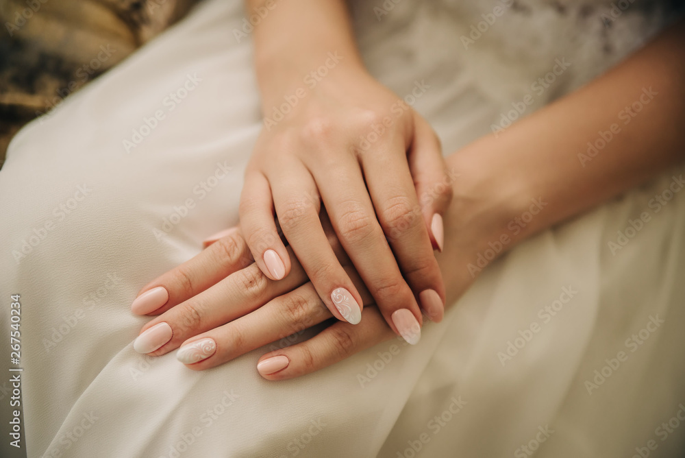 beautiful hands of a girl on a white wedding dress beautiful hands of a girl on a white wedding dress