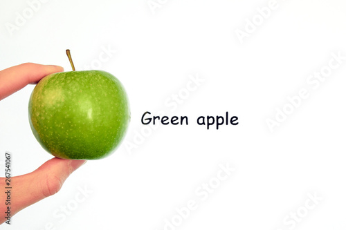 a green apple on a white background and the inscription "green apple"