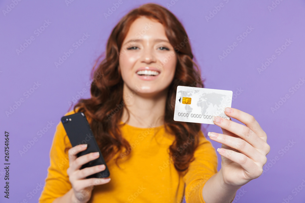 Portrait of a pretty young redheaded woman standing Portrait of a pretty young redheaded woman standing