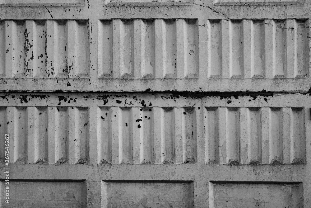 The concrete texture, wall, with cracks and scratches can be used as a background