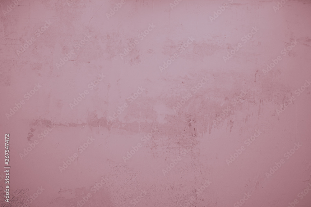 Fototapeta premium Rosa, lila farbene, verputzte Wand als Hintergrund. Steinwand, Betonwand im Industrial Style. Verschmutzte und raue Strukturen über das ganze Bild. 