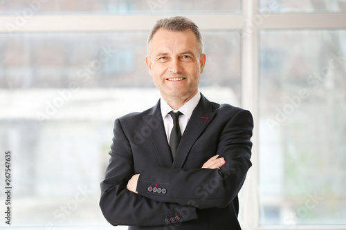 Handsome mature businessman in office photo
