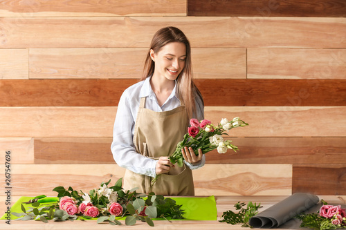 Florist making bouquet at t...