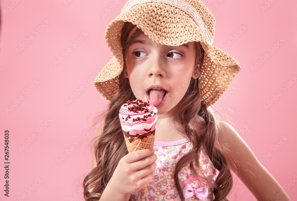 Portrait of a little cheerful girl with ice cream on a colored background Portrait of a little cheerful girl with ice cream on a colored background