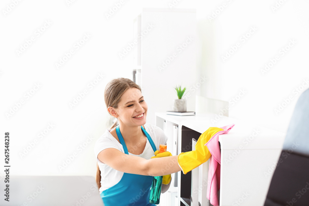 Female janitor cleaning office Female janitor cleaning office