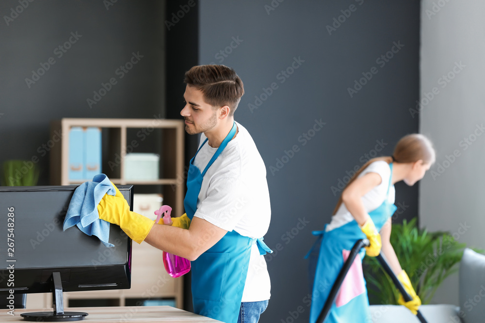 Team of janitors cleaning office Team of janitors cleaning office