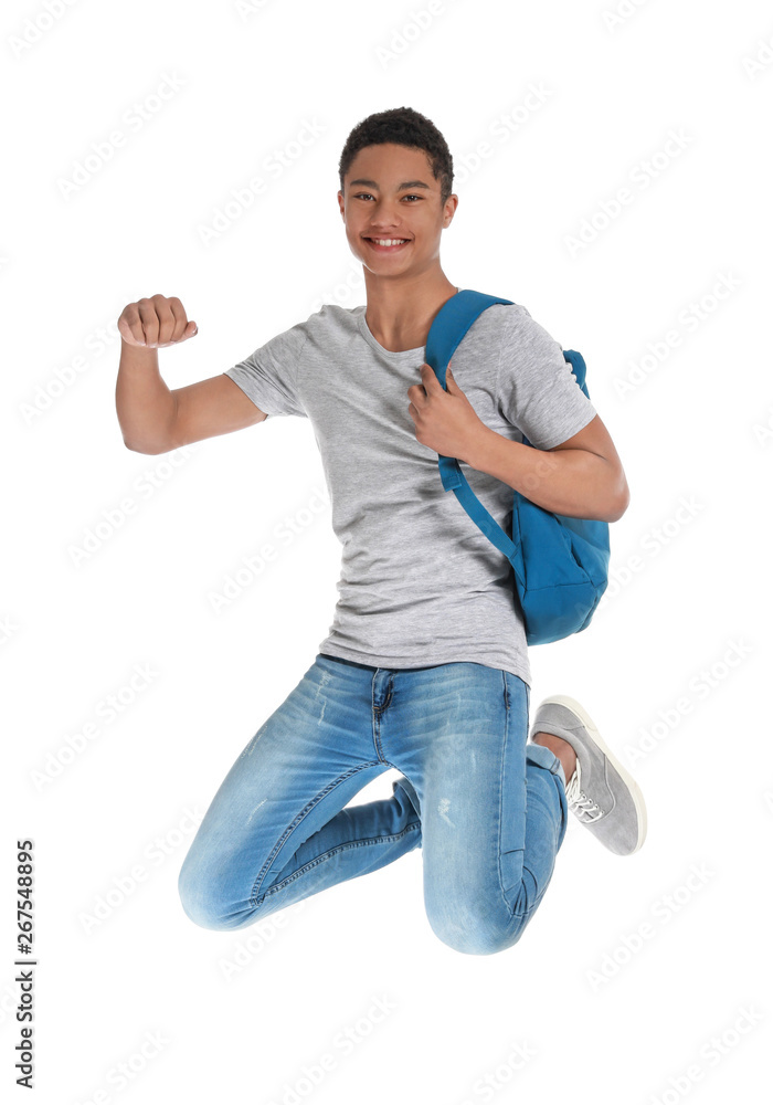 Jumping African-American teenage boy on white background Jumping African-American teenage boy on white background
