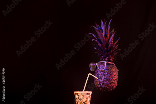 club concept ,black and gold pineapples in sunglasses