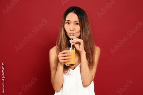 Asian woman with glass of j...