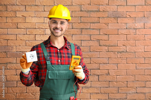 Male electrician with multi...
