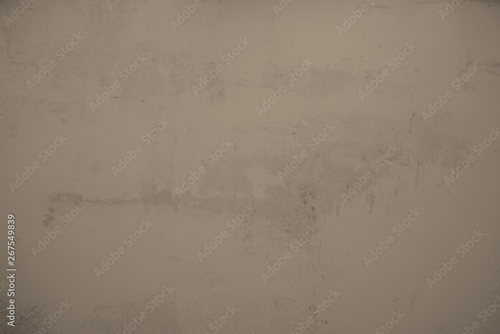 Fototapeta premium alte, braune, Betonmauer, Steinmauer. Strukturierte Zementwand im Industrial Style als Hintergrund und kreatives Element für Kunst