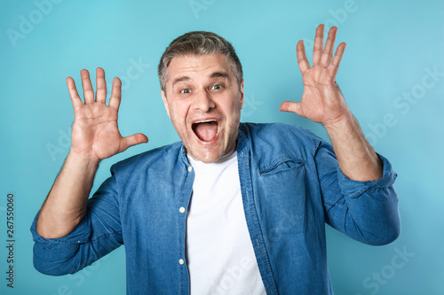 Screaming mature man on col...