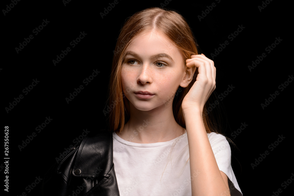 Fototapeta premium Sad teenage girl on dark background