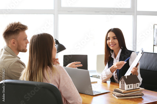 Young couple in office of r...