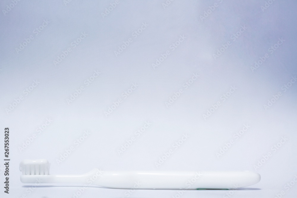 Brushing teeth on a abtract white background Brushing teeth on a abtract white background