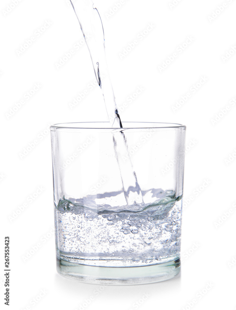 Pouring of fresh water into glass on white background Pouring of fresh water into glass on white background