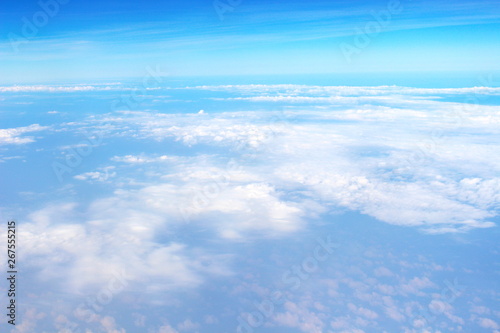 Beautiful of blue sky and white cloud looks from the window of the plane.