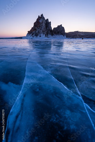 Shaman rock  sacred stone in Olkhon island in a beautiful morning sunrise  Baikal lake in winter  Russia