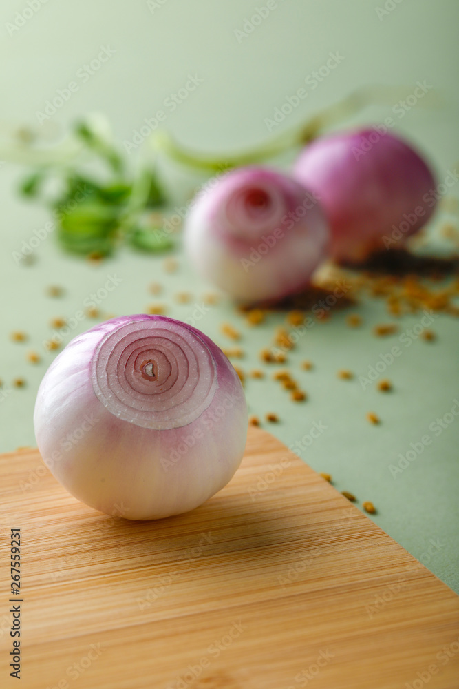 red onions on wooden board