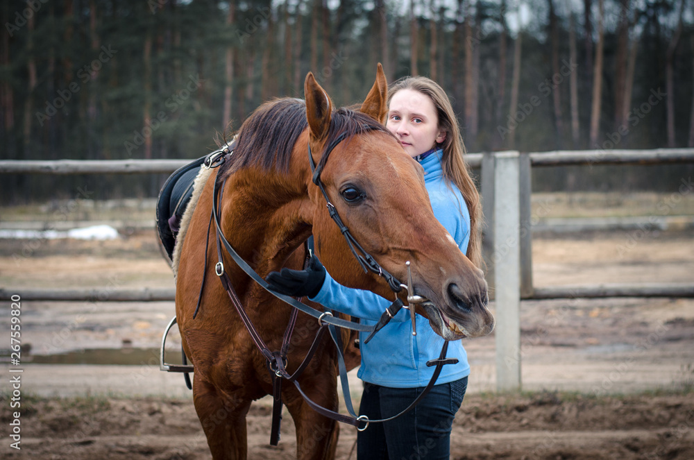 portrait of young woman with funny red don mare horse