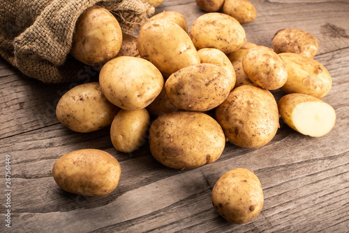 New potatoes on wooden background