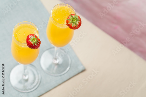 Mimosa cocktail and strawberries