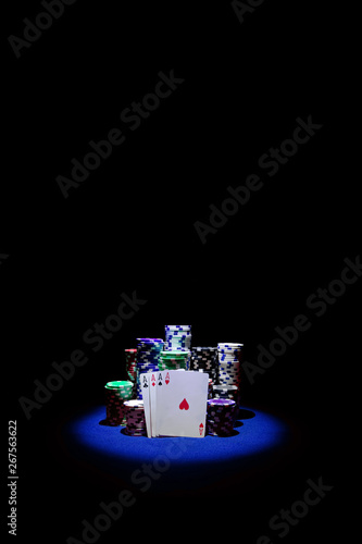 Four Aces with chip stack on blue Table VERTICAL