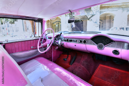 Canvas Print Interior of a classic pink retro cabriolet car in Havana, Cuba