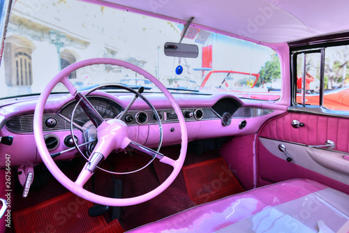 Canvas Print Interior of a classic pink retro cabriolet car in Havana, Cuba