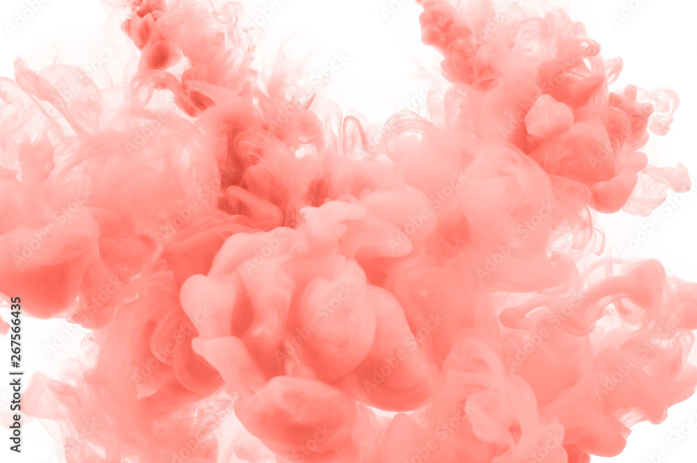 Coral ink splashes in the water. Abstract background for your design.