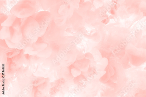 Coral ink splashes in the water. Abstract background for your design. © eternal aviv
