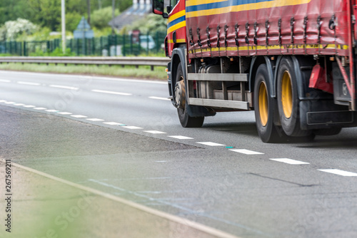 curtain side truck on uk motorway in fast motion