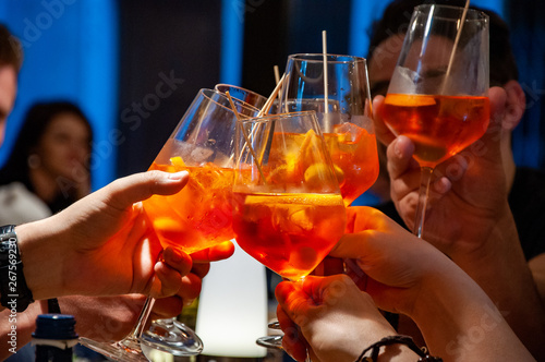 Cheers friends with aperol spritz photo