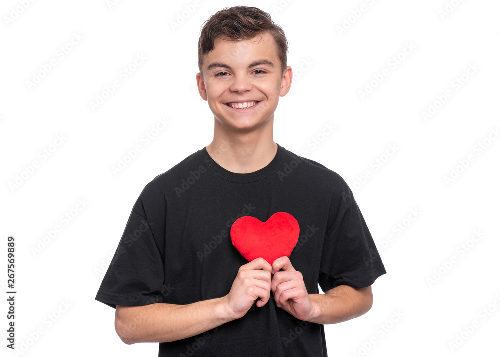 Happy Valentines Day. Cute young Teen Boy in Love with Red plush Heart in his hands. Smiling Child looking at camera, isolated on white background. Happy Valentines Day. Cute young Teen Boy in Love with Red plush Heart in his hands. Smiling Child looking at camera, isolated on white background.
