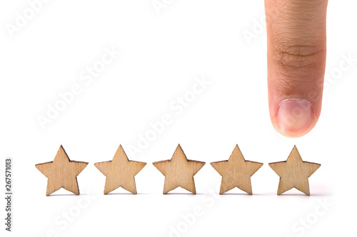 Hand pointing wooden five star shape on white background