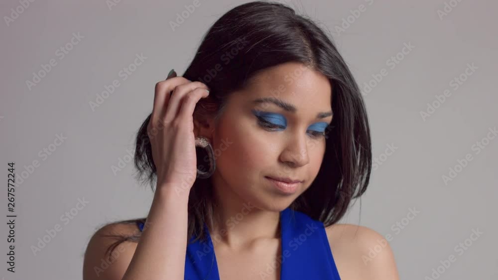 shy beauty mixed race model watching down and then lift up her chin and watching to the camera shy beauty mixed race model watching down and then lift up her chin and watching to the camera