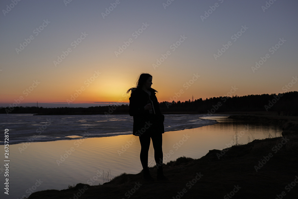 girl smoking, drinking wine and watching the sunset