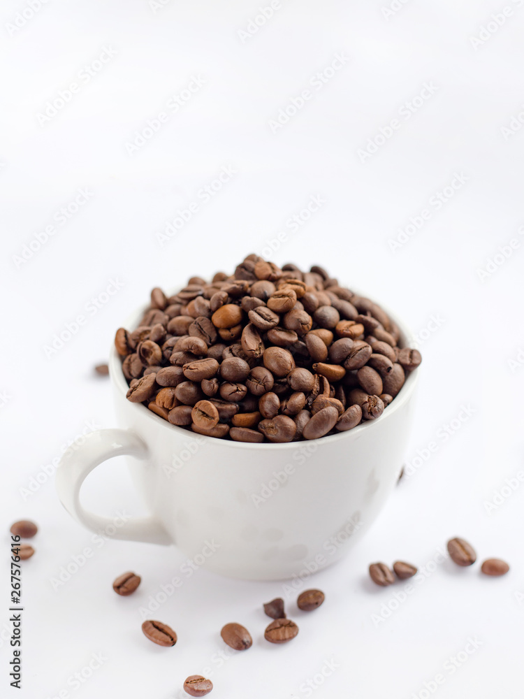 Coffee beans in white cup isolated on white background, drinks concept Coffee beans in white cup isolated on white background, drinks concept