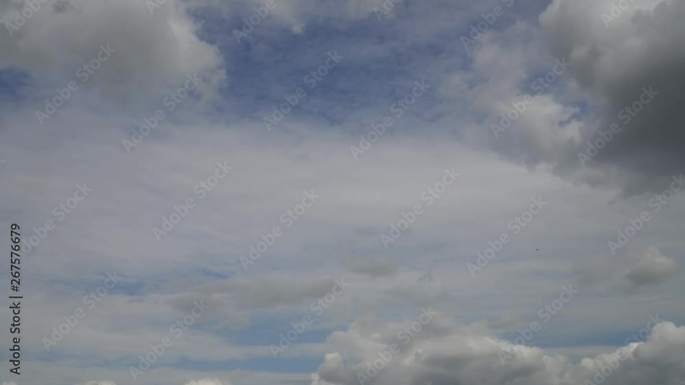 Cloudy blue sky with small birds who flies in the distance. Fluffy feather clouds and cumulus in heaven. Cloudy blue sky with small birds who flies in the distance. Fluffy feather clouds and cumulus in heaven.