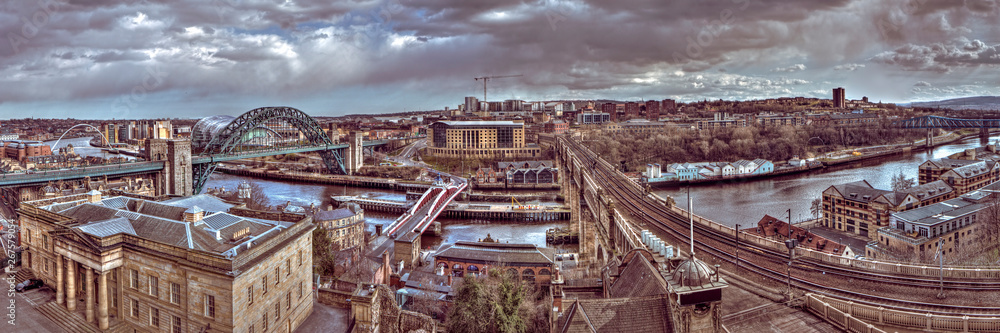 Panoramic landscape view of Newcastle upon Tyne & Gateshead shot in HDR on an overcast summer daytime from the castle keep