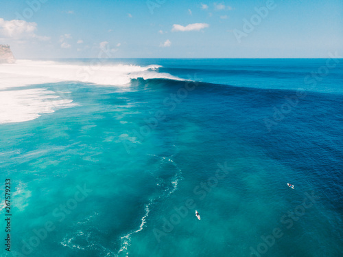 Aerial view of big wave surfing in Bali. Big waves in ocean