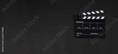 Clapperboard or clap board or movie slate use in video production ,film, cinema industry on black background..