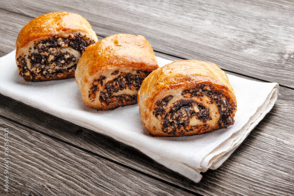 Crispy freshly baked cookies with poppy seeds on a wooden background. Crispy freshly baked cookies with poppy seeds on a wooden background.