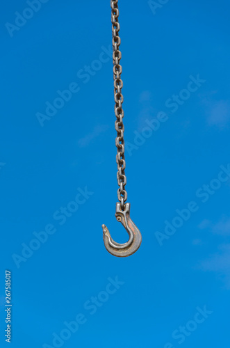 Crane hook against blue sky