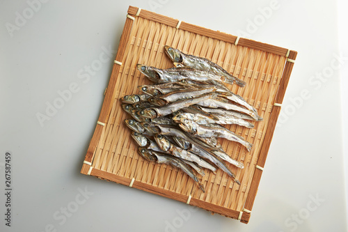 Dried fishes on bamboo sieve  photo